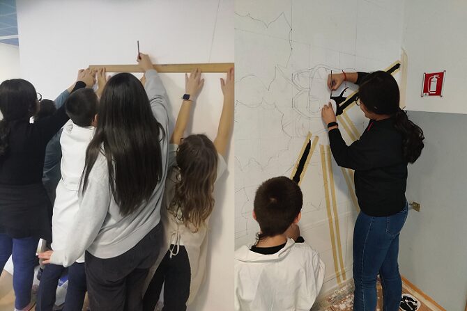 foto di studenti che disegnano il murale